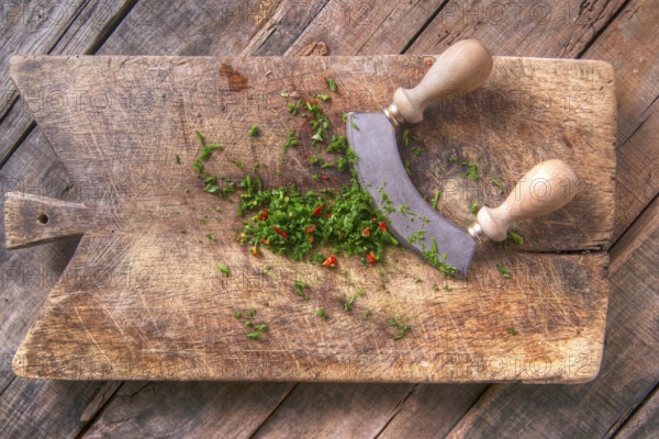 Preparation of chopped chives and chili on wooden-border