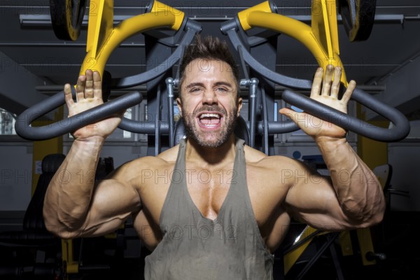 An image of a handsome bearded bodybuilding man doing chest workout