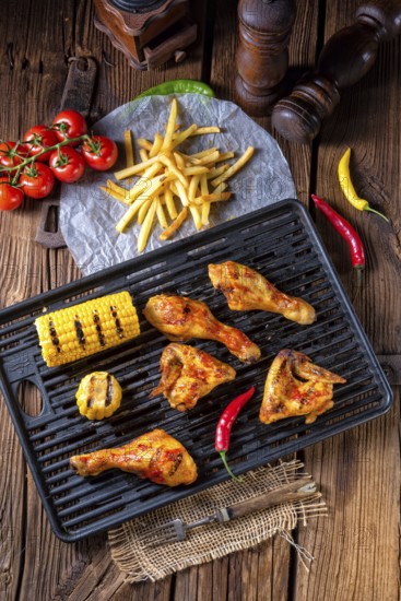 Rustic Grilled chicken wings, legs, and spicy corn