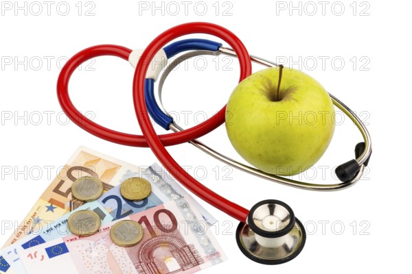 An apple and a stethoscope at a doctor's surgery. Symbolic photo for healthy and vitamin-rich nutrition. Austria