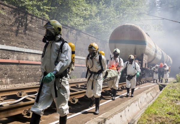 Sofia, Bulgaria - May 19, 2015: A team working with toxic acids and chemicals is saving people from a chemical cargo train crash. Teams from Fire department are participating in an emergency training with spilled toxic and flammable materials