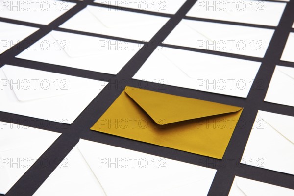 Composition with white and gold envelopes on the table. The photo suitable for various holidays and anniversaries