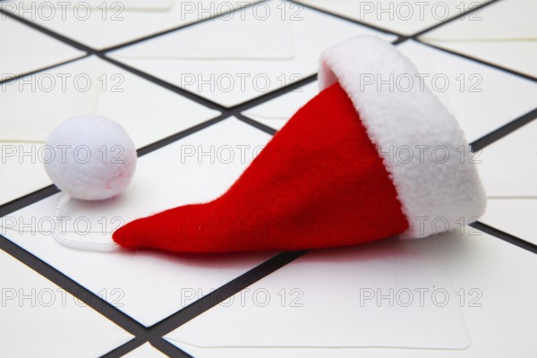 Santa Claus red hat and Christmas white envelopes. Christmas composition