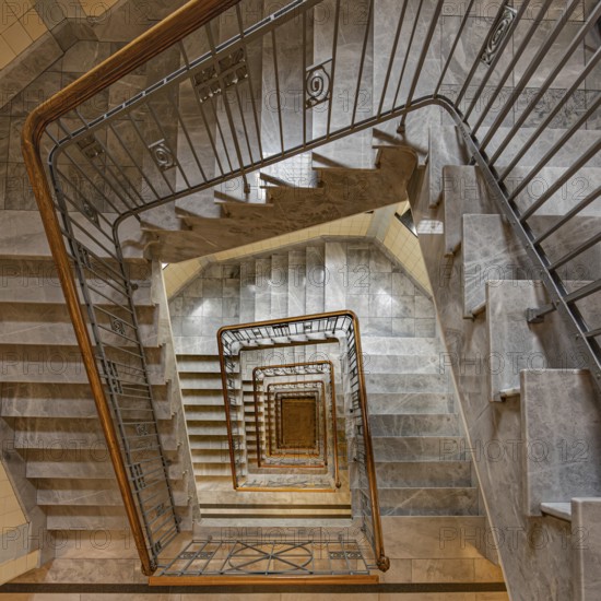 View from above of a spiral marble staircase with a striking banister and geometric pattern, Old Town Hamburg, Free and Hanseatic City of Hamburg, Germany