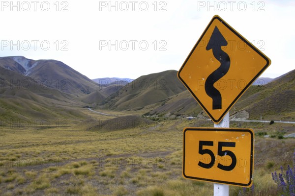 Traffic sign in New Zealand indicating a road with bends