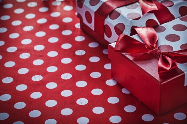 Christmas gifts on polka-dot red textile celebrations concept