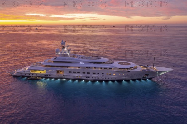 Aerial view of 115 metre motor yacht PELORUS, built in 2003 by the Bremen shipyard Lürssen Yachts for a client from Saudi Arabia, then bought by Russian oligarch Roman Abramovich and later by David Geffen, here the superyacht is anchored off the Principality of Monaco, Mediterranean Sea