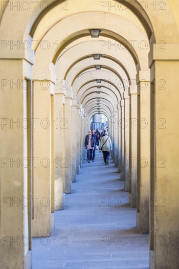Vasari Corridor with tourists in Florence, Italy