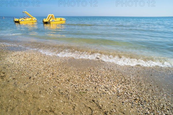 Yellow lifeboat on the beach. Italian beach