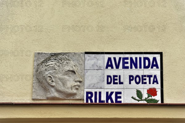 Memorial plaque on a wall with a relief image and Rilke's name, Ronda, Malaga province, Andalusia, Spain