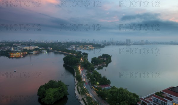 The skyline of Hanoi, the capital city of Vietnam and the Hoan Kiem lake during a colorful sunset