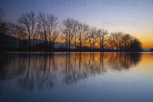 Dusk on the Berounka river, Czech Republic. Symmetry landscape at sunset