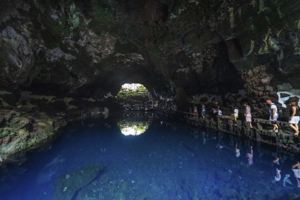 LANZAROTE, CANARY ISLANDS - JULY 22, 2022: Famous tourist attraction - Los Jameos Del Agua and subterranean salt lake. Part of a lava tube (1.5 km) created by the eruption of the Monte Corona volcano