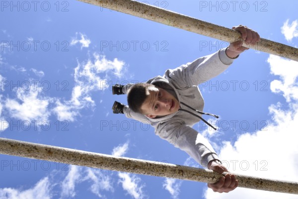 A young gymnast. Sports training for soldiers