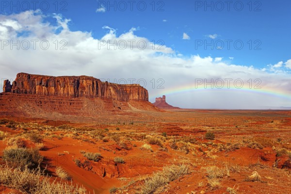 Navajo Indian Reservations. USA. Monument Valley Sentinel Mesa and the bright rainbow. Monument Valley is a unique geological formation in Arizona and Utah
