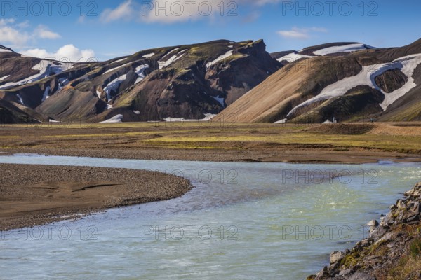 The picturesque valley in the national park Landmannalaugar, Iceland. Summer flood of meltwater blocks the way to the tourist camping