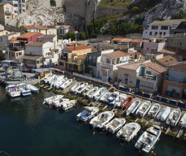 The famous harbour and port Vallon des Auffes situated between historic buildings offers an unique and peaceful atmosphere in the midst of the city