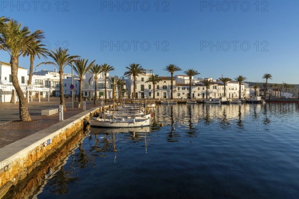 Fornells, Spain, 25 January, 2024: view of the village and harbour of Fornells in northern Menorca with reflections in the water