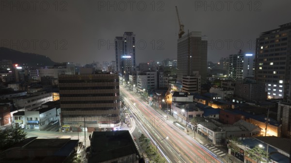 Metropolis at night. Cityscape with cars driving on highway. Seoul, Republic of Korea