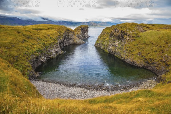 The picturesque coastal bay near the fishing village of Arnastapi. Iceland in July