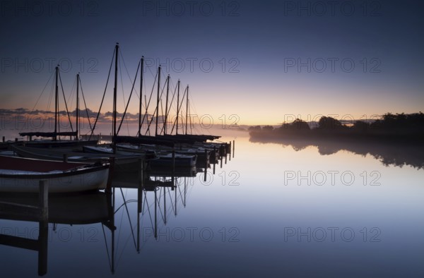 Calm yacht harbor at sunrise, Netherlands