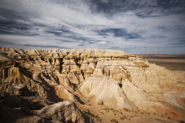 The flaming cliffs of Bayanzag, a region in the Gobi desert of Mongolia famous for discoveries of dinosaur fossils and the first set of dinosaur eggs
