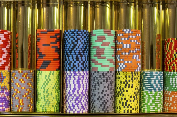 Colourful roulette chips in a casino on a gambling table. Lots of chips with different nomination and colours