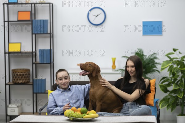 In a stylishly designed home environment, a boy and a girl are happily enjoying delightful moments with a friendly dog