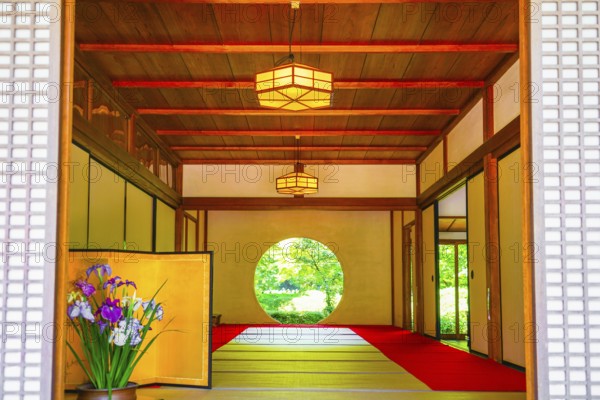 Round window and the fresh green of Meigetsuin. Shooting Location: Kamakura, Kanagawa Prefecture