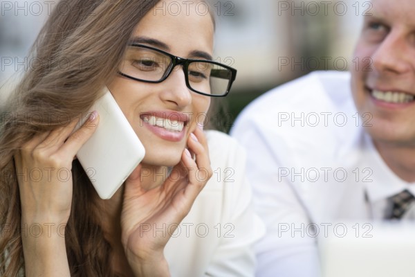 Close portrait of a young businesswoman. talking on the phone