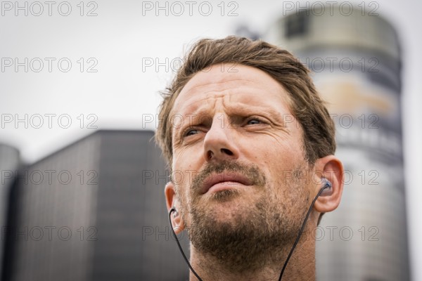 NTT INDYCAR SERIES driver, ROMAIN GROSJEAN (77) of Geneva, Switzerland stands for the national anthem before the Detroit Grand Prix on the Streets of Detroit in Detroit MI