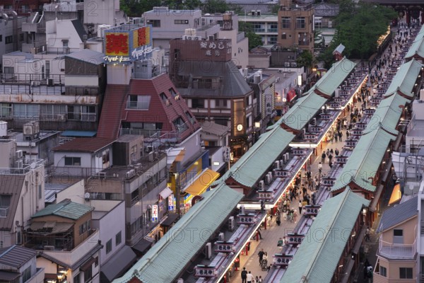Tourists walk through the Nakamise-dori shopping street of Senso-ji in Asakusa. Senso-ji is the oldest Buddhist temple in Tokyo