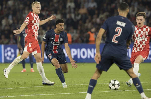 Football match, Viktor TSYGANKOV Girona FC right on the ball, Achraf HAKIMI 2 Paris St. Germain tries to stop him, left Donny VAN DE BEEK Girona FC and Warren ZAIRE-EMERY Paris St. Germain watch the scene, Parc des Princes football stadium, Paris