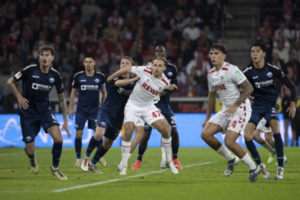 Andreas Dick (DFL/DFB REGULATIONS PROHIBIT ANY USE OF PHOTOGRAPHS AS IMAGE SEQUENCES AND/OR QUASI-VIDEO), RheinEnergieStadion, Cologne, North Rhine-Westphalia, Mathias Olesen (1.FC Köln, midfield, #47), Calvin Brackelmann (defence, SC Paderborn 07, #4), Julian Pauli (1.FC Köln, defence, #24), Santiago Castaneda (midfield, SC Paderborn 07, #5), 2nd Bundesliga, 1.FC Köln, SC Paderborn 07 on 25.10.2024 at the RheinEnergieStadion in Cologne Germany