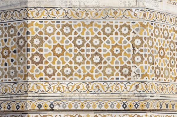 Tomb of I'timad-ud-Daulah, Mirza Ghiyas Beg, a high official in the Mughal Empire. Surrounded by charbag, the Indo-Persian style garden, the white marble mausoleum decorated with pietra dura stone inlay technic is often called Baby Taj or Bachcha Taj. It is a fine example of the Mughal architecture, and was one of the inspirations for the design of the Taj Mahal. Details of the decoration – pietra dura, the stone inlay work. Agra, Uttar Pradesh, India