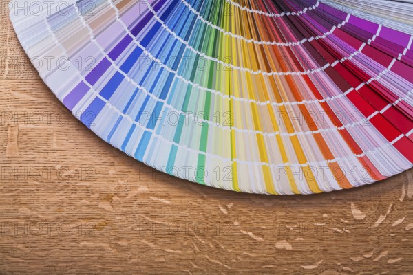 Pantone color palette guide on wooden board construction concept