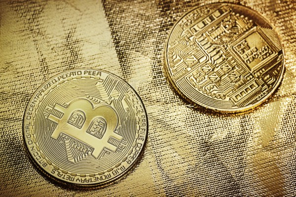 Two bitkoins on gold backgound
