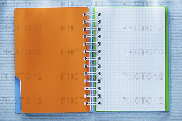 Spiral checked notebook directly above
