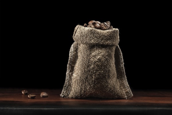 Classic Jute Bag Coffee Beans Standing On Wood Board Isolated