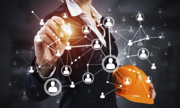 Businesswoman pointing on abstract 3d network. Back view of woman engineer in business suit and safety helmet. Social connection and networking. Futuristic technology concept with 3d plexus structure