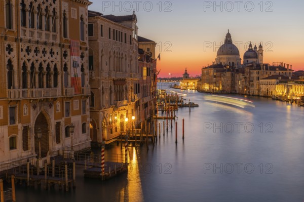 Morning atmosphere in front of sunrise, view of the Grand Canal from the Ponte dell' Accademia, Basilica Maria della Salute in the background, long exposure, Venice, Italy