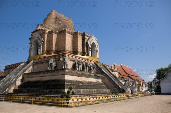 Wat Chedi Luang translates literally from the Thai as ‘Monastery of the Great Stupa'. Construction of the temple began at the end of the 14th century when the Lan Na Kingdom was in its prime. King Saen Muang Ma (1385-1401) intended it as the site of a great reliquary to enshrine the ashes of his father, King Ku Na (1355-85). Today it is the the site of the Lak Muang or City Pillar. The annual Inthakin ceremony occurs within the confines of the temple.<br/><br/> Chiang Mai (meaning 'new city'), sometimes written as 'Chiengmai' or 'Chiangmai', is the largest and most culturally significant city in northern Thailand. King Mengrai founded the city of Chiang Mai in 1296, and it succeeded Chiang Rai as capital of the Lanna kingdom