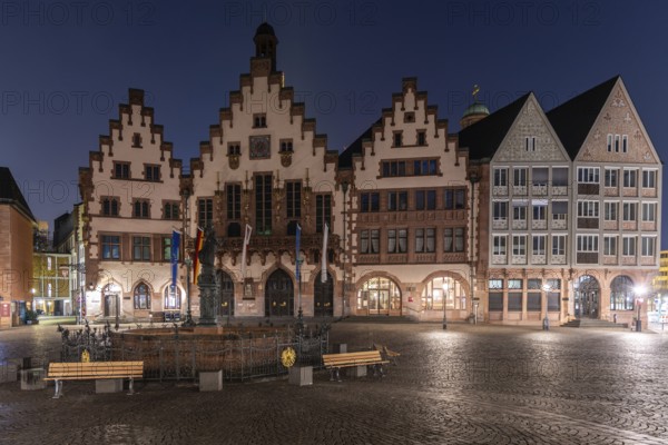 Half-timbered houses in a historic city centre, wheelhouse on the Römerberg taken in the morning without people at sunrise. Frankfurt on the Main