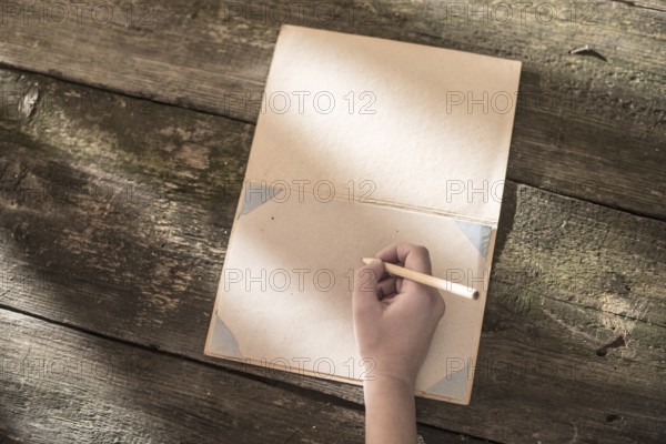 Vintage pencil and drawing paper. Weak sunlight