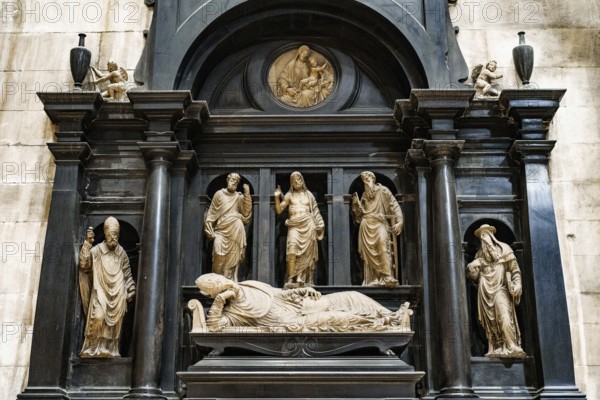 Statue of the lying cardinal in the Duomo. Milan, Italy.