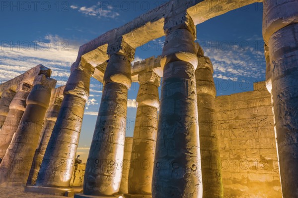 Illuminated columns in Luxor Temple at sunset, Egypt