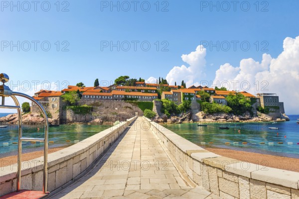 Road to Sveti Stefan, peninsula with ancient architecture in Adriatic sea