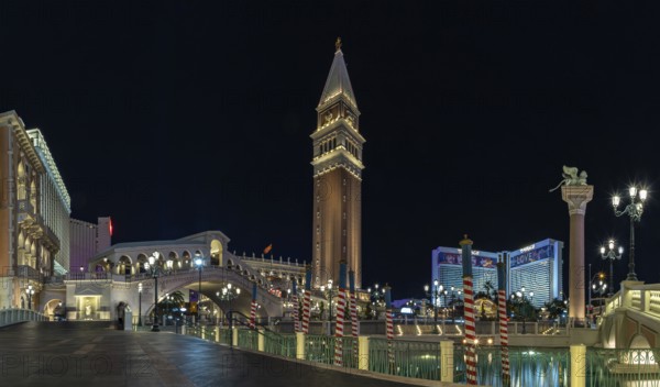 A picture of the Venetian Las Vegas at night, with the Rialto Bridge on the left and the Campanile Tower at the center
