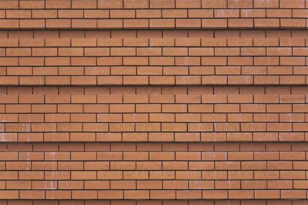 Wall of a cathedral ideally laid out by red bricks in Madrid