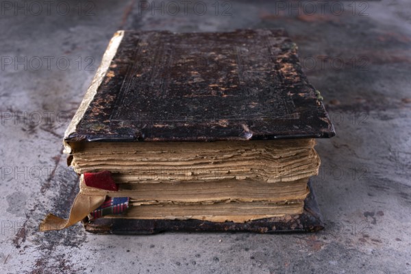 Ancient book, bible, Koran on a dark background